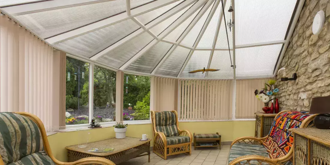 Roller blinds fitted on a semi-circular slanted conservatory roof