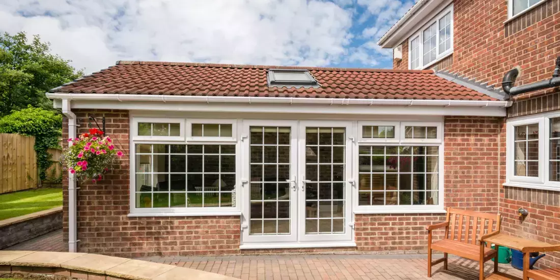 A brick conservatory built into the side of a house