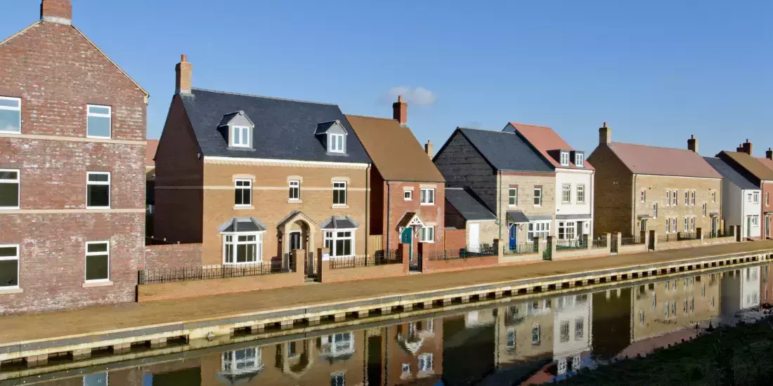 New build houses alongside a canal